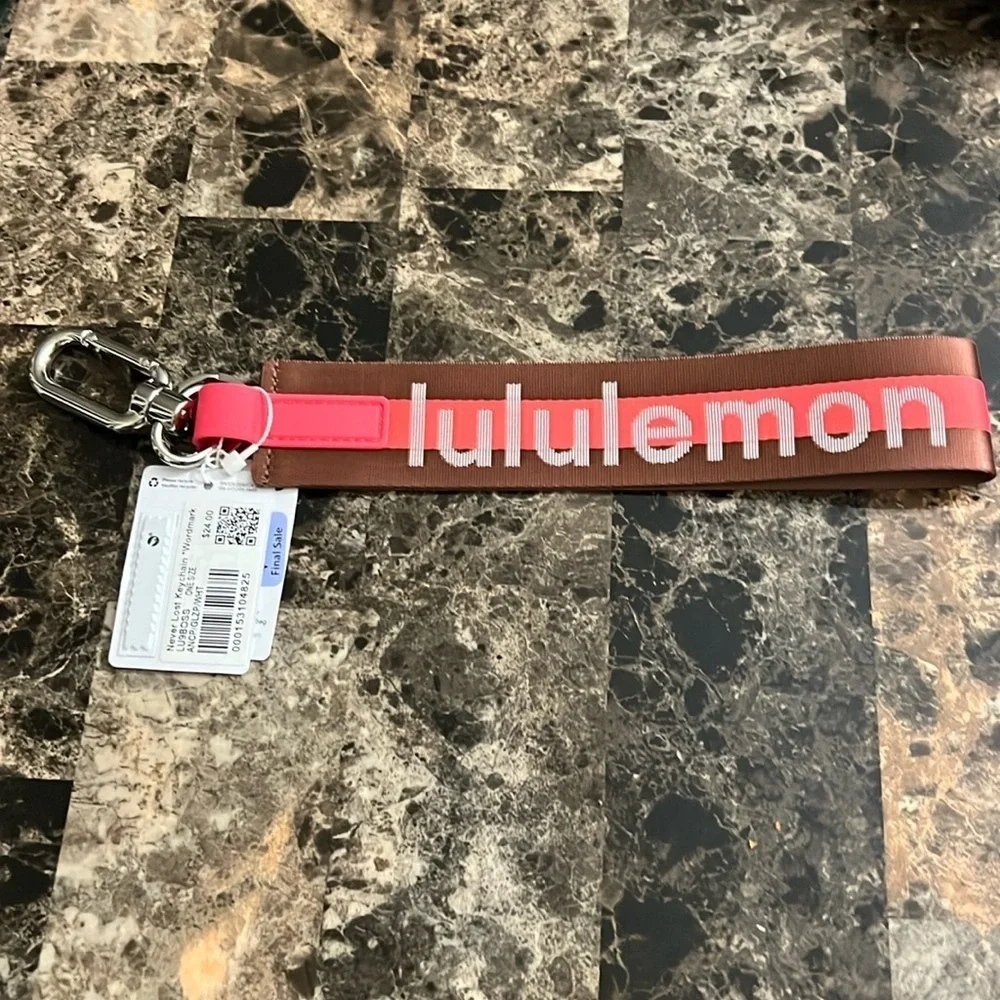 LULULEMON NEVER LOST KEYCHAIN ORANGE AND BROWN COLOR NWT